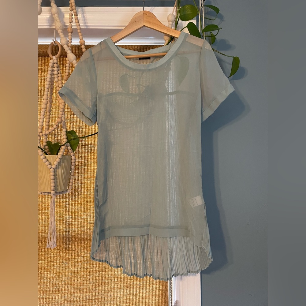 Sheer blouse! Beautiful mint green. Perfect to pair with a great pair of jeans.